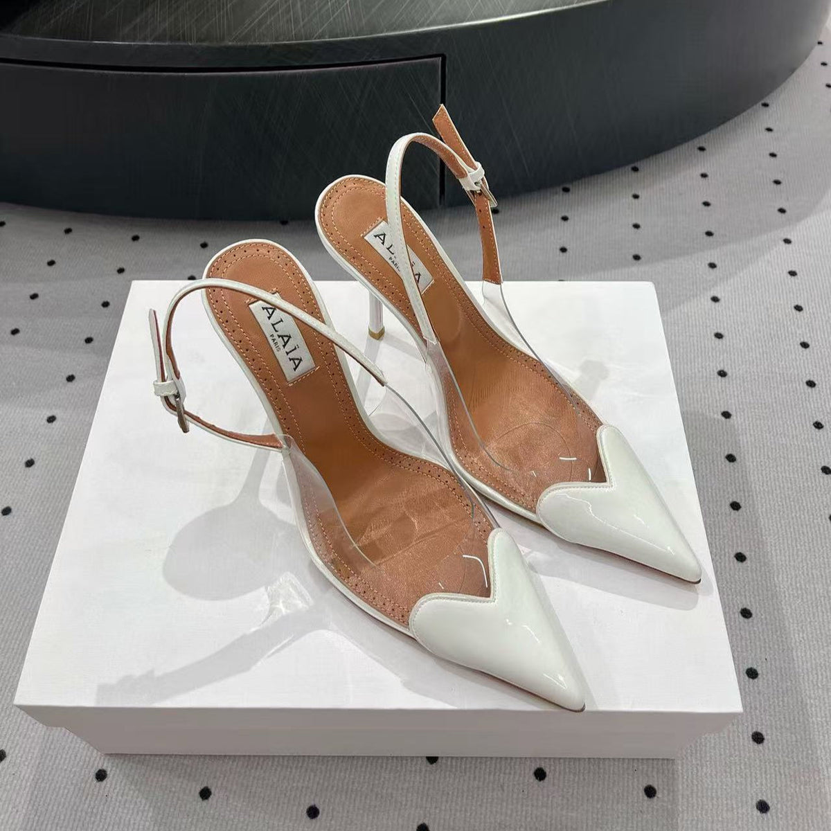 ALAIA HIGH 9 CM SLINGBACK IN WHITE PATENT CALFSKIN AND FILM