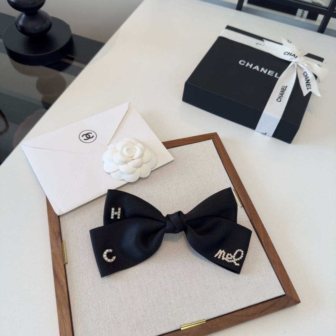 CHANEL 26S BOW HAIR CLIP IN BLACK SATIN 503134