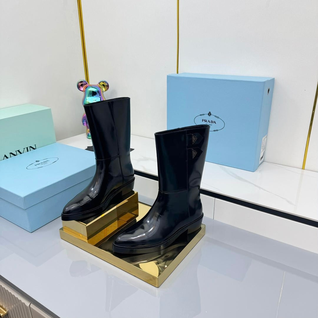 PRADA 25S BROOKLYN BOOTS 50MM IN BLACK GLOSSY CALFSKIN WITH LOGO