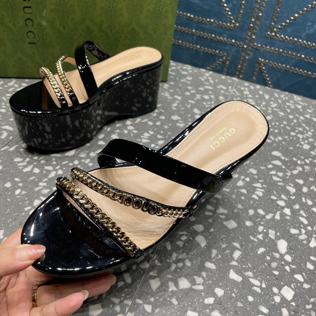 HIGH WEDGE PLATFORM IN BLACK CALFSKIN WITH GOLD HARDWARE