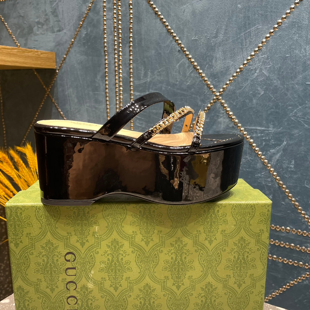 HIGH WEDGE PLATFORM IN BLACK CALFSKIN WITH GOLD HARDWARE