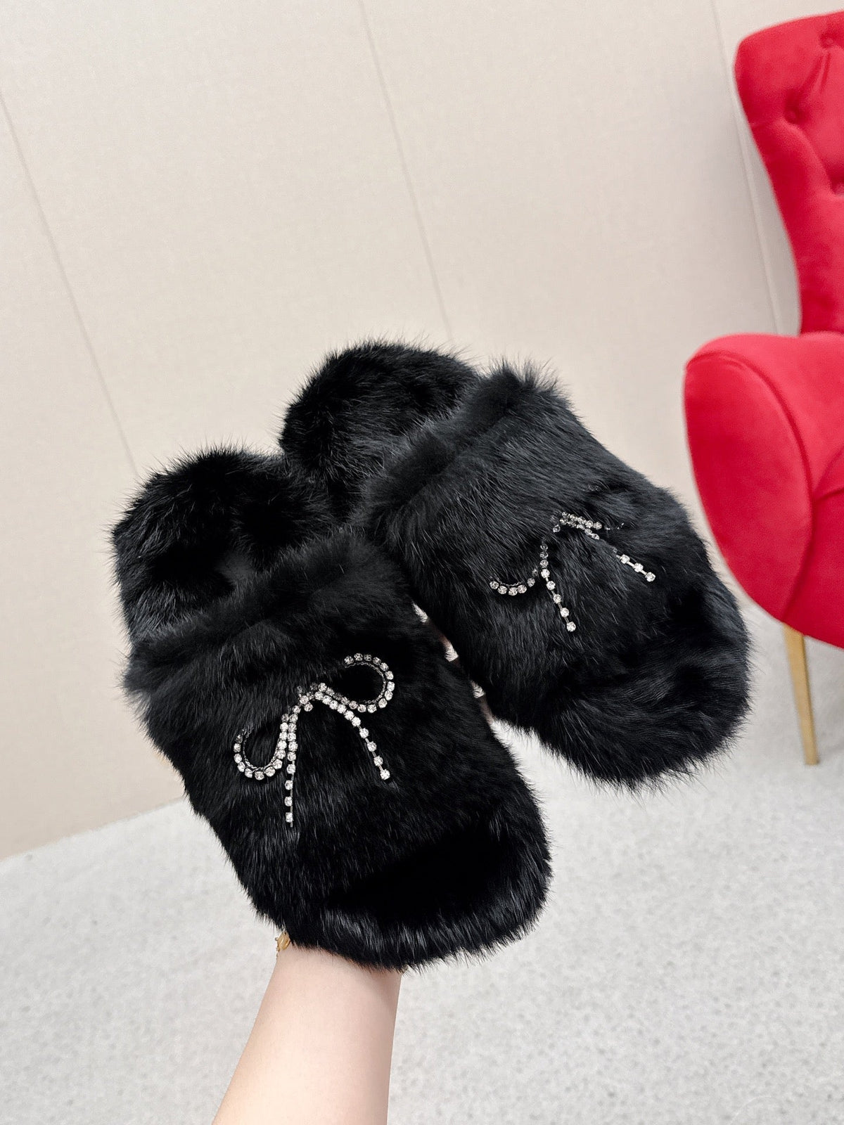 BALENCIAGA 25S SOFT FUR SLIPPERS IN BLACK FUR WITH RHINESTONE BOW