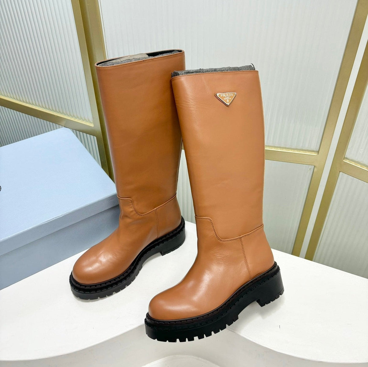 KNEE BOOTS WITH TRIANGLE LOGO IN CAMEL CALFSKIN