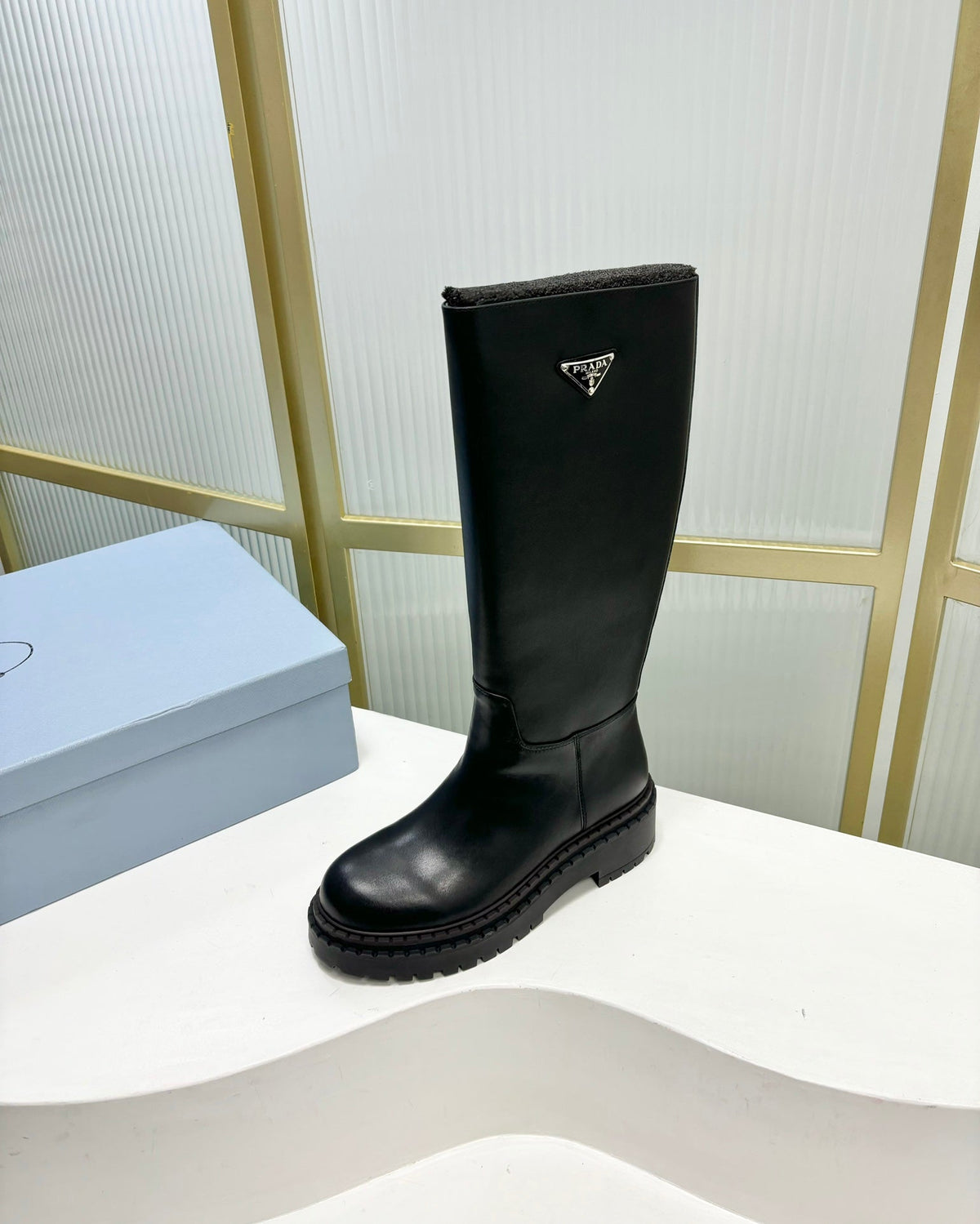KNEE BOOTS WITH TRIANGLE LOGO IN BLACK CALFSKIN