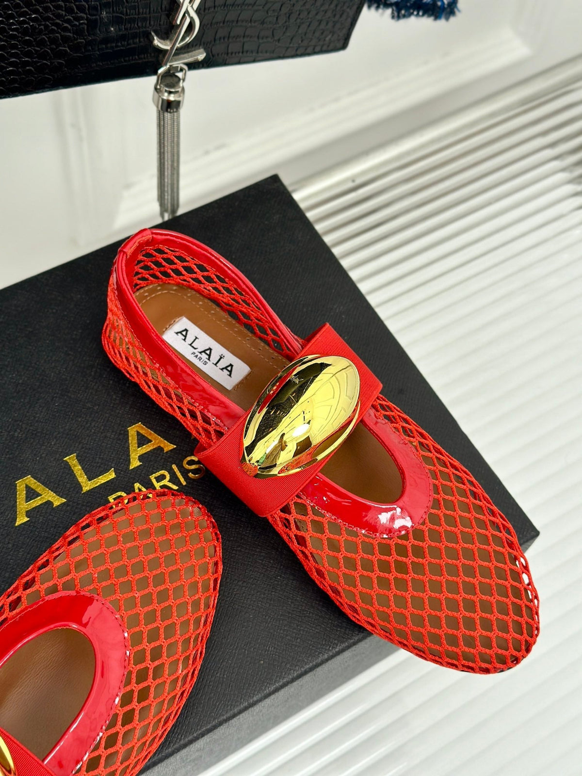 ALAIA MARY JANE SHOES IN CHERRY RED MESH WITH GOLD HARDWARE