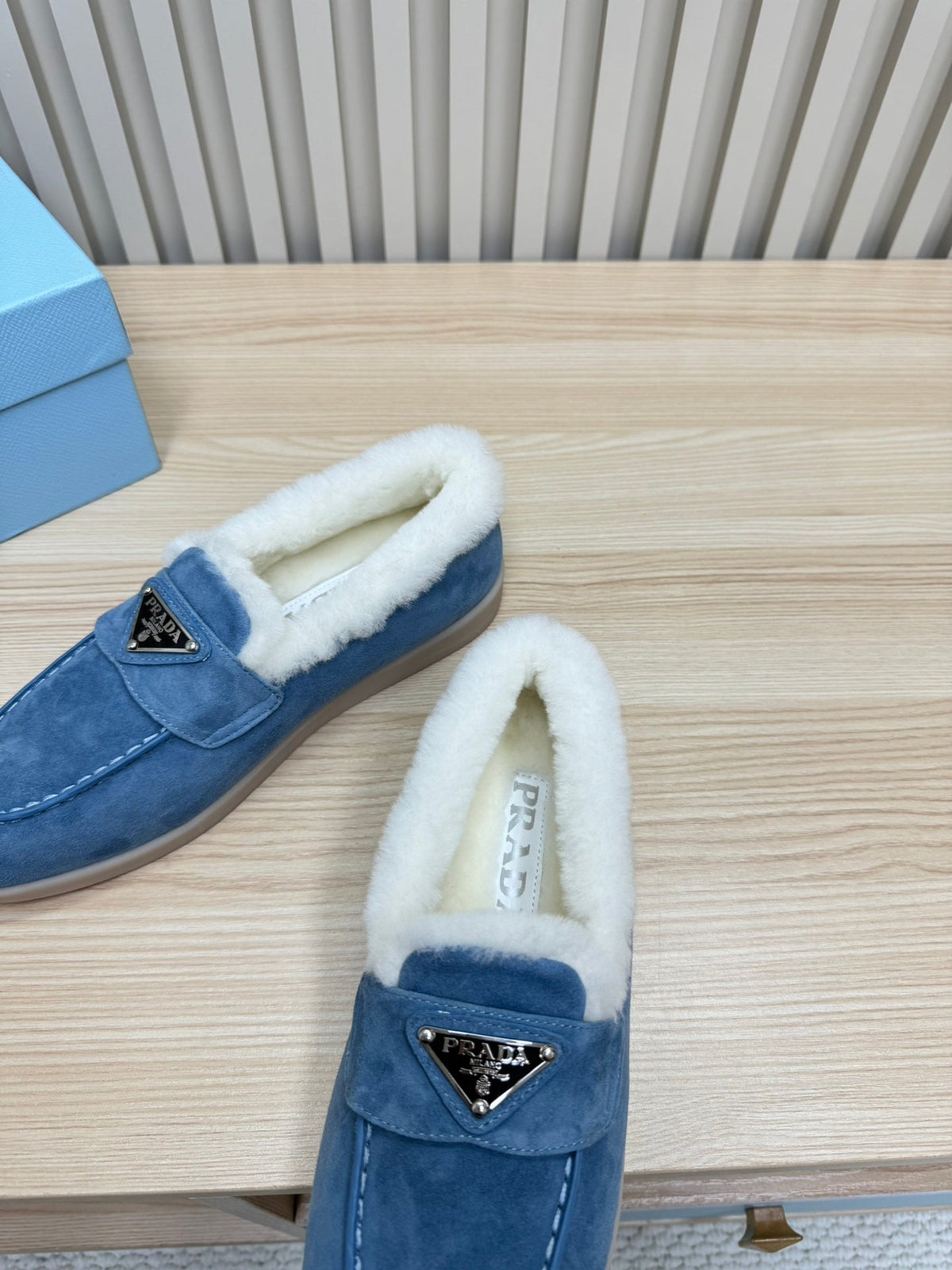 LOAFER IN AZURE BLUE SUEDE AND FUR LINING ATTACHED TRIANGLE LOGO