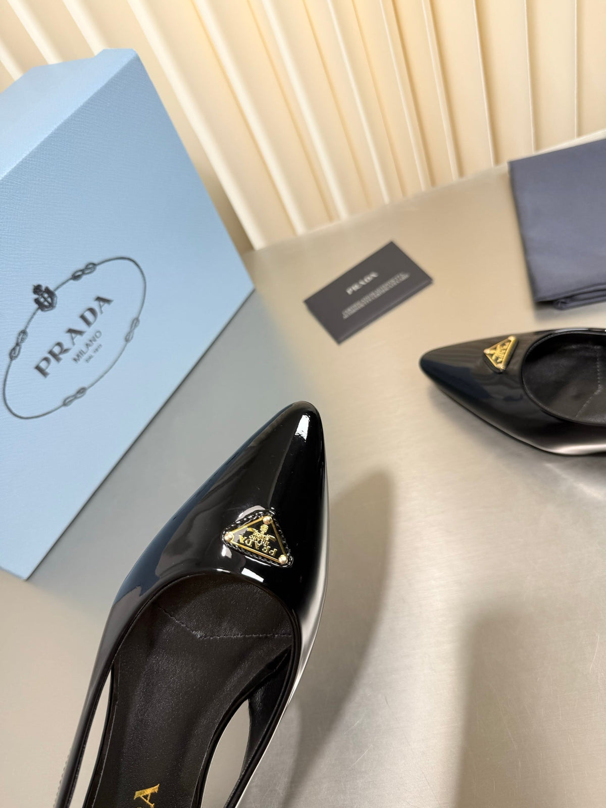 PRADA 26S SLINGBACK FLATS IN BLACK PATENT CALFSKIN WITH GOLD HARDWARE