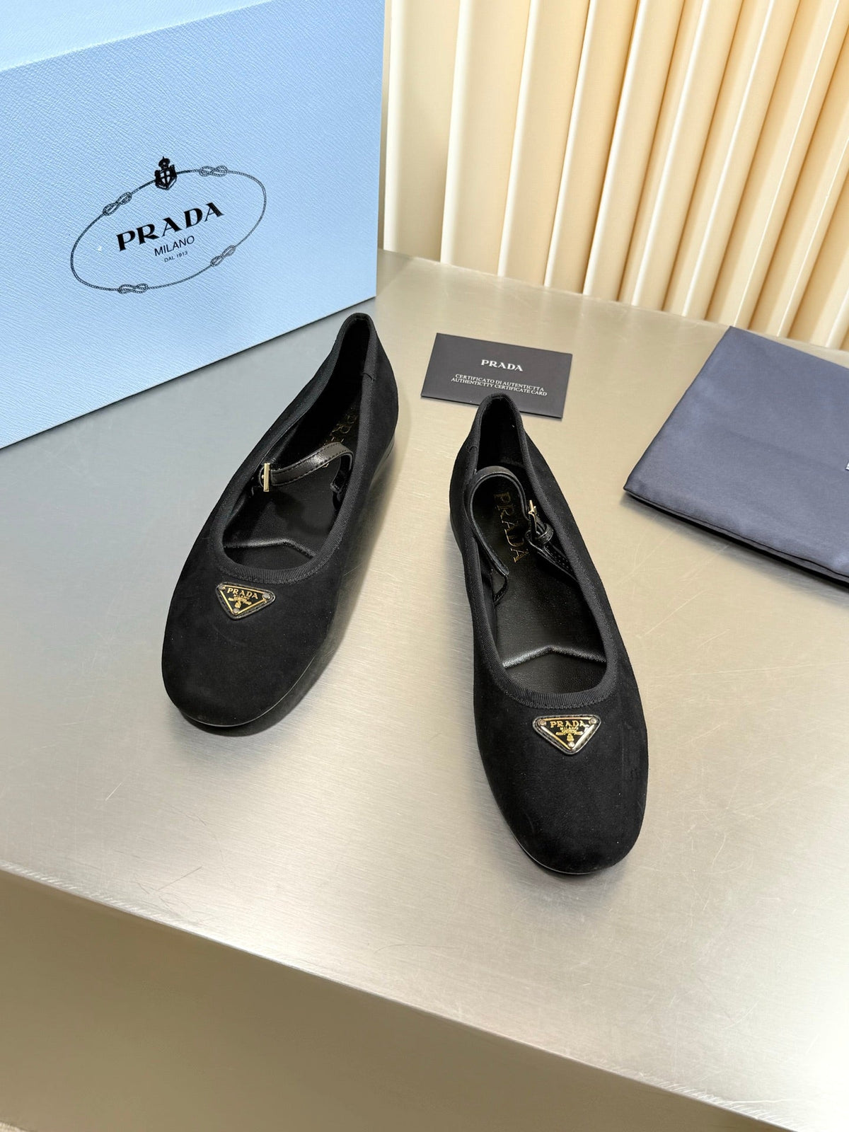 PRADA 26S MARY JANE FLATS IN BLACK SUEDE