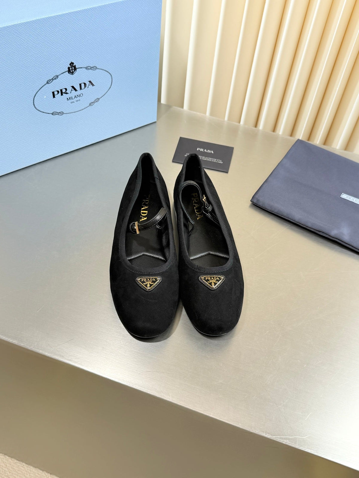 PRADA 26S MARY JANE FLATS IN BLACK SUEDE