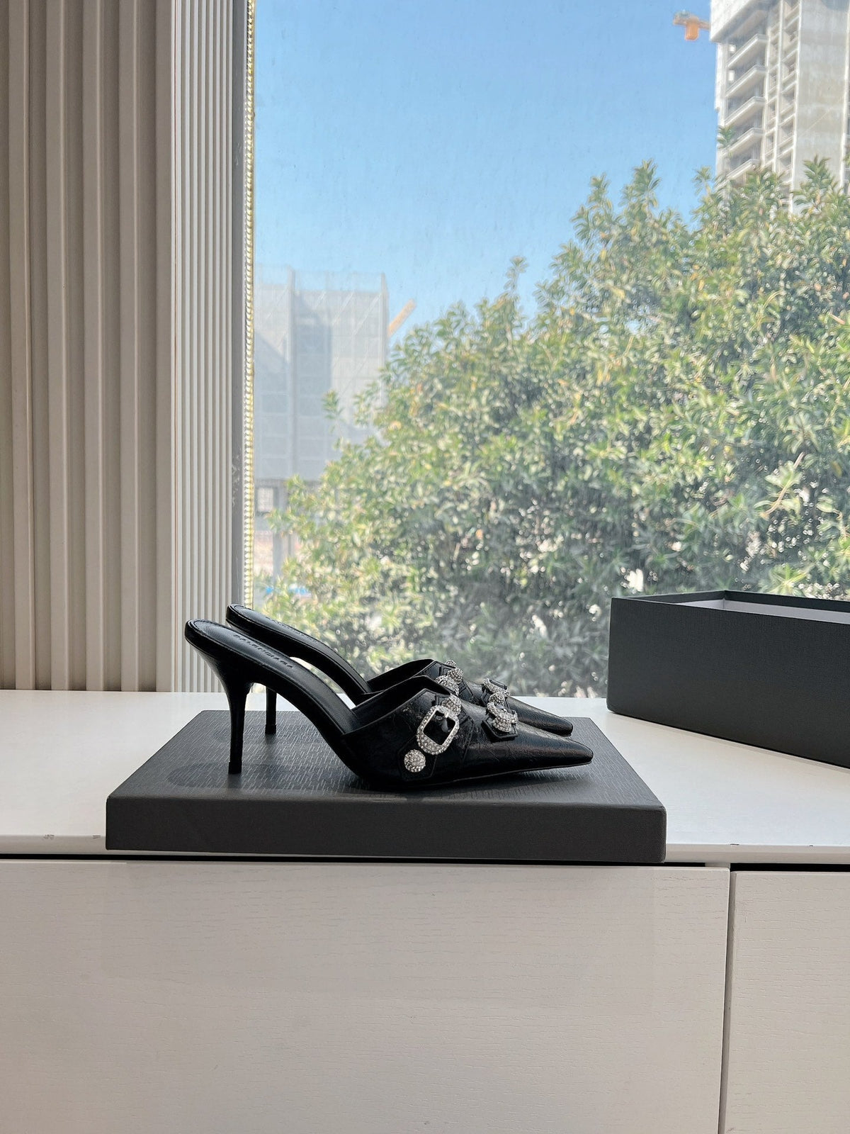 CRYSTAL BUCKLE BLACK WAX-OIL SHEEPSKIN HEELED MULES