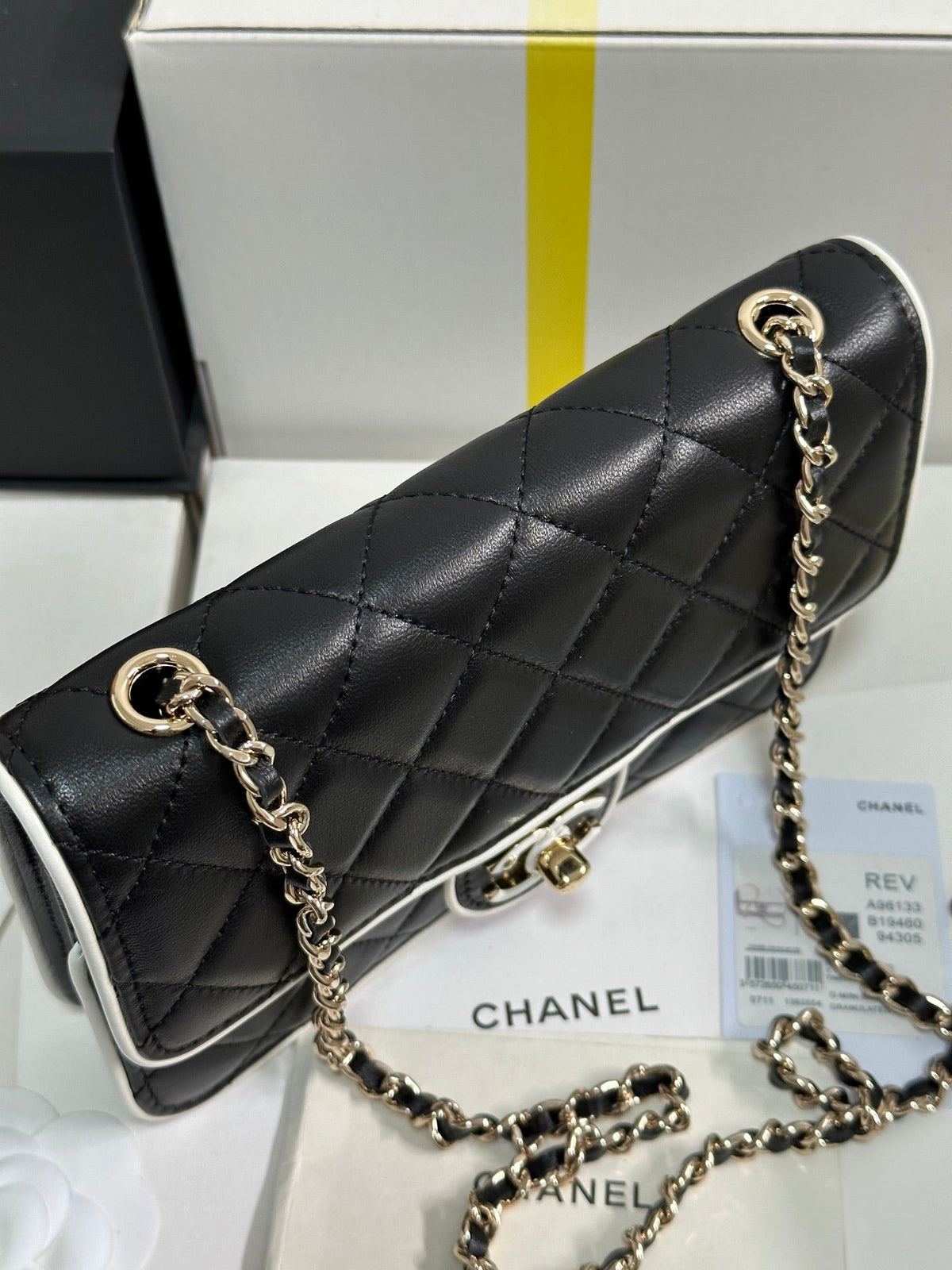 QUILTED FLAP BAG WITH WHITE TRIM 19 IN BLACK LAMBSKIN