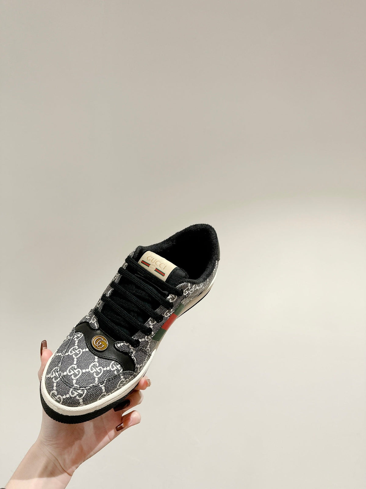 GUCCI 26S SCREENER SNEAKER IN BLACK AND WHITE GG CANVAS