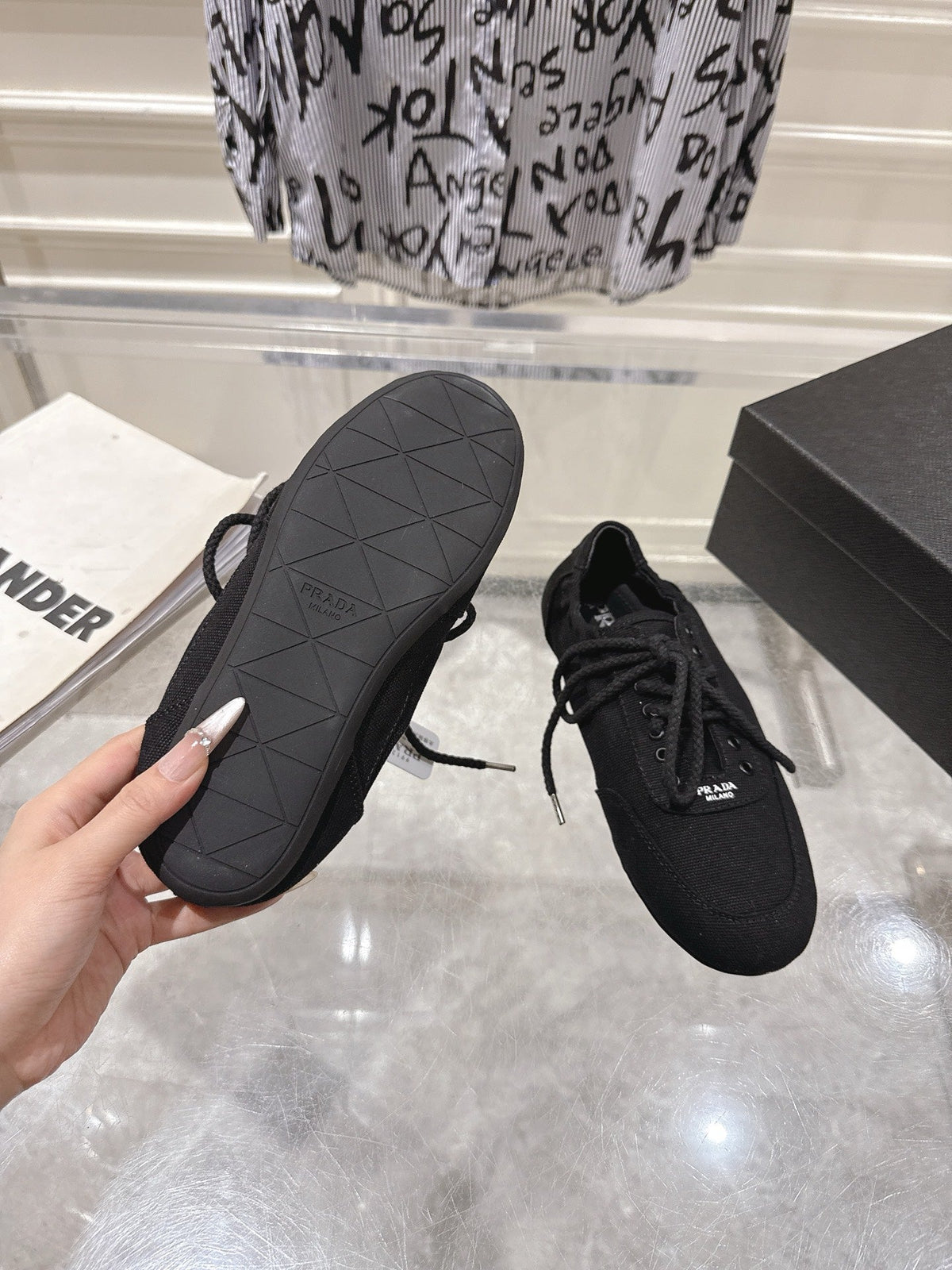 PRADA 26S COLLAPSE SNEAKERS IN BLACK CANVAS