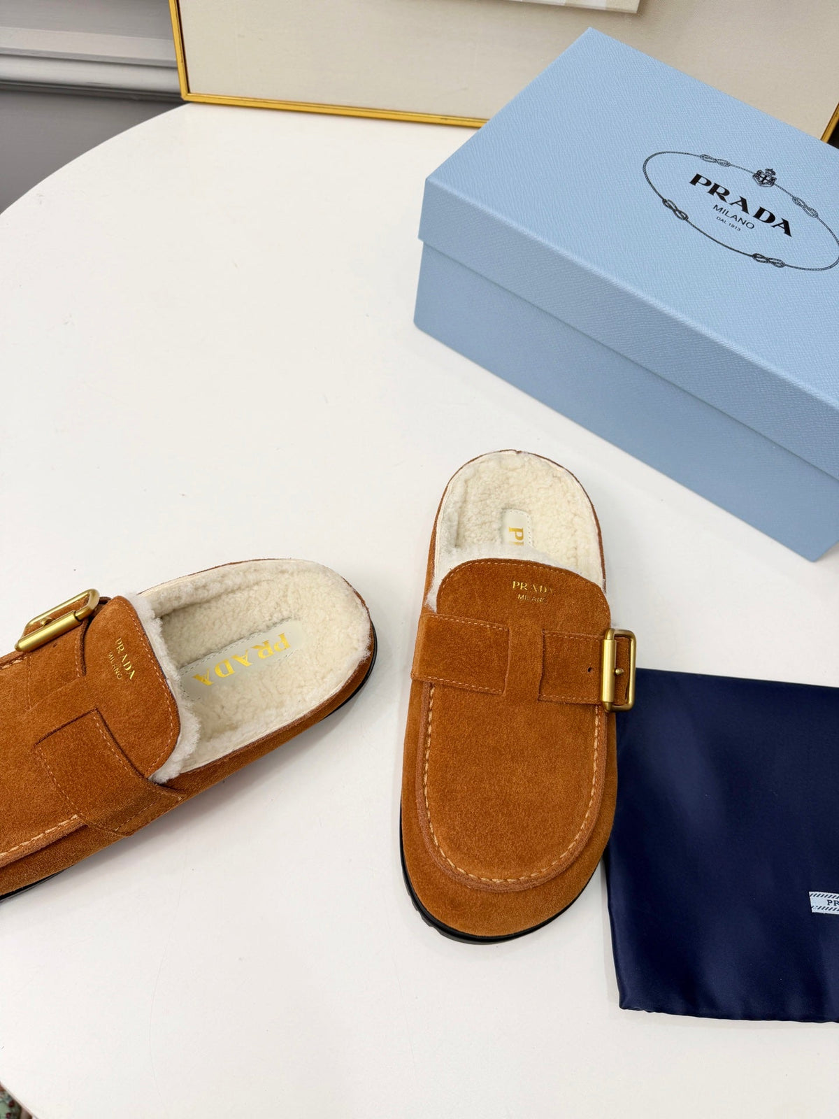 PRADA 26S SHEARLING-LINED MULES IN COGNAC BROWN SUEDE