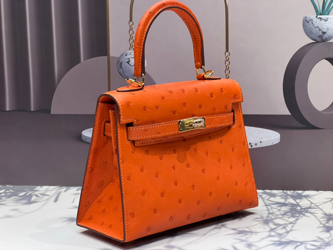 KELLY BAG 20 IN FIRE ORANGE OSTRICH LEATHER WITH GOLD HARDWARE