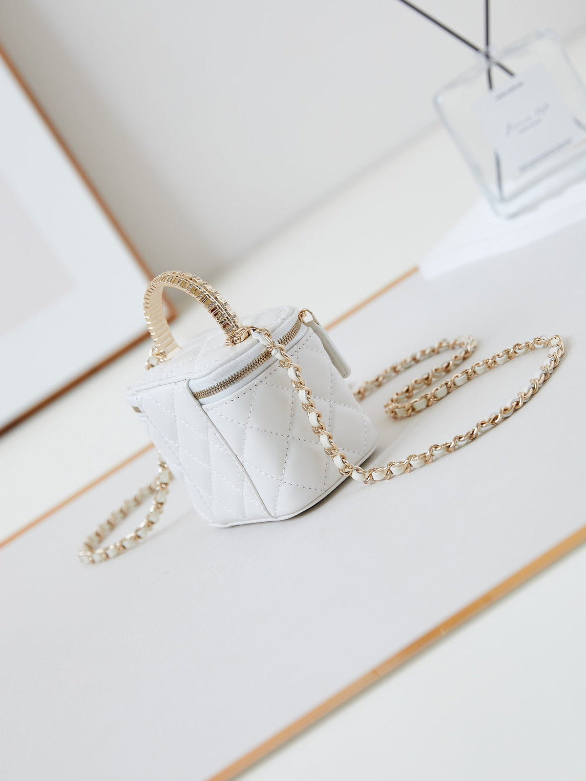 CHANEL 25S MINI VANITY BAG 11 CM IN WHITE LAMBSKIN WITH CRYSTAL-EMBELLISHED CC LOGO