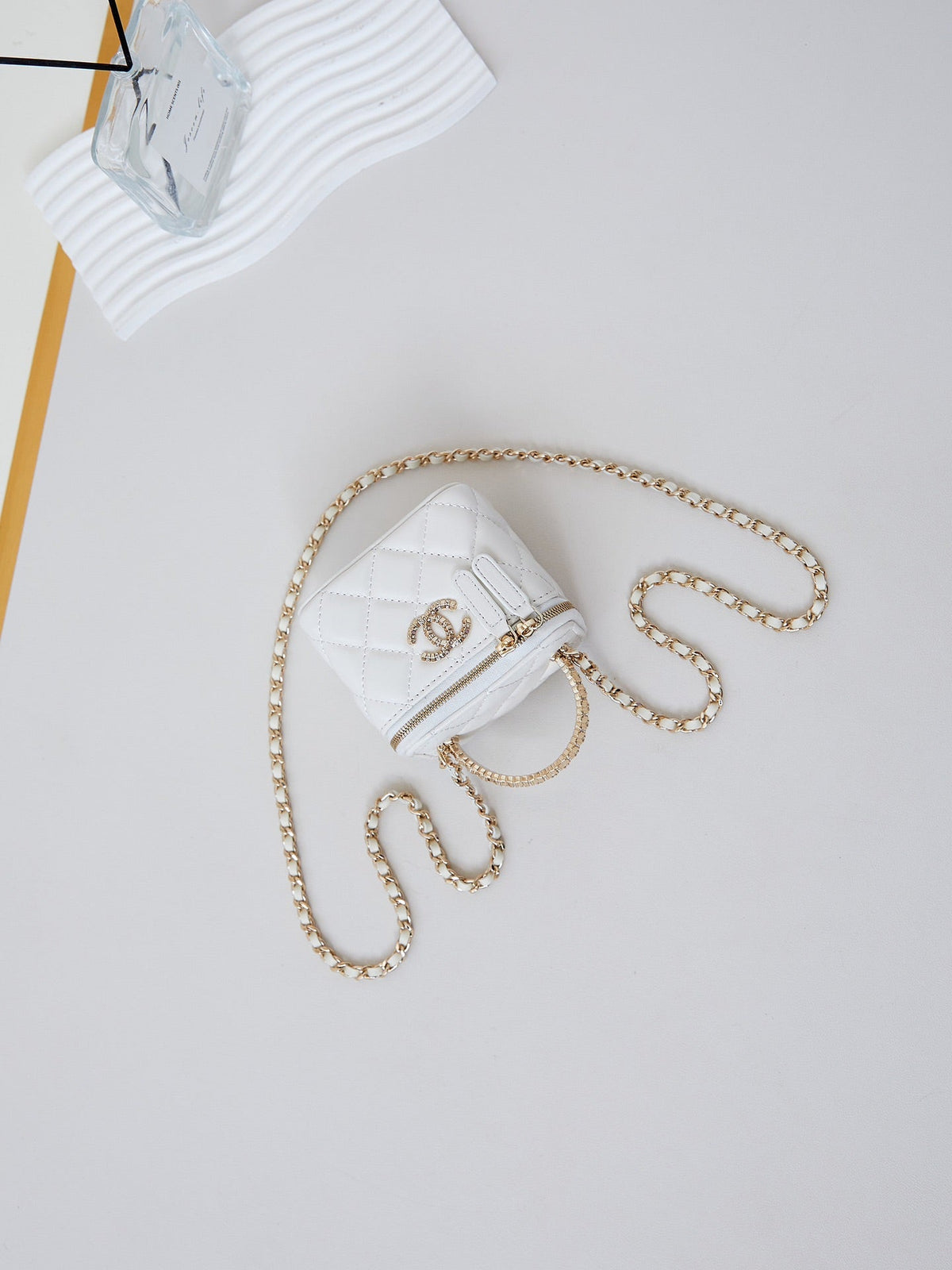 CHANEL 25S MINI VANITY BAG 11 CM IN WHITE LAMBSKIN WITH CRYSTAL-EMBELLISHED CC LOGO