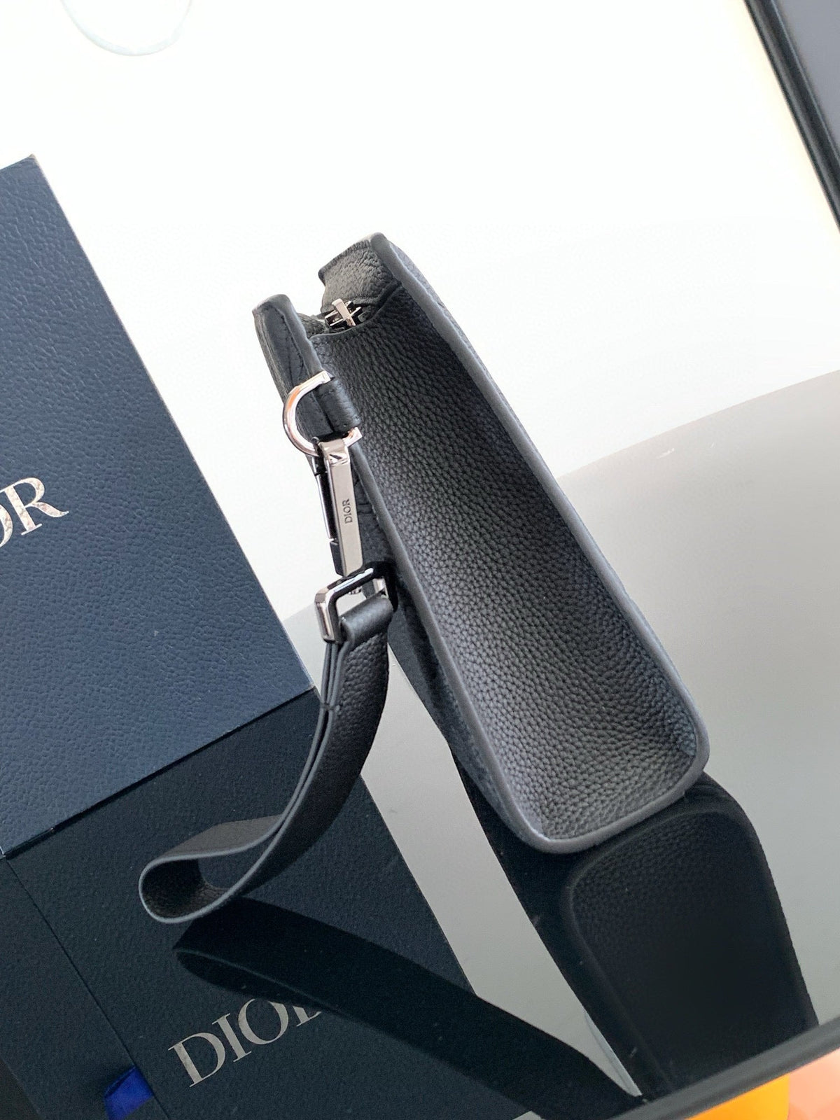 CLUTCH 27 BAG IN BLACK CALFSKIN EMBOSSED LOGO