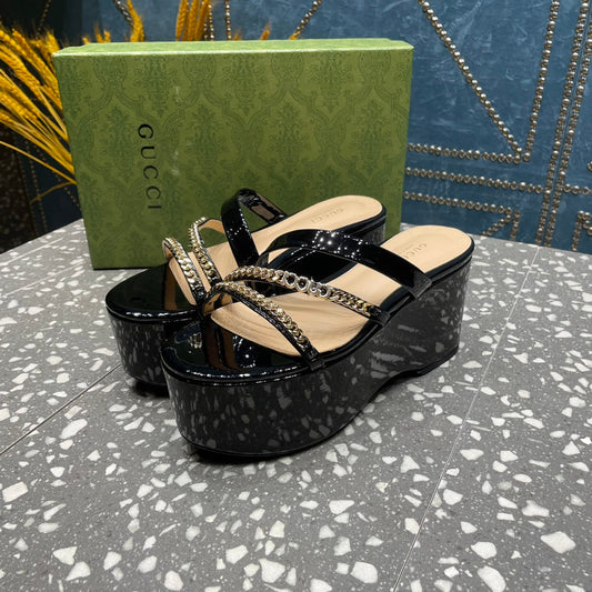 HIGH WEDGE PLATFORM IN BLACK CALFSKIN WITH GOLD HARDWARE