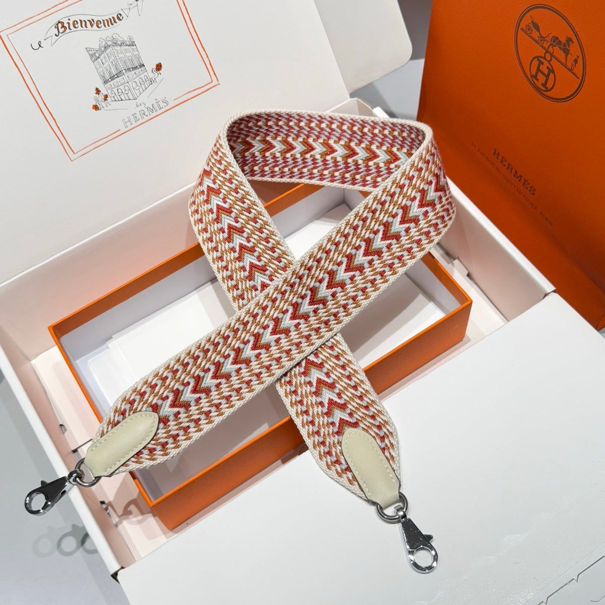 25S HERMES BAG STRAP ORANGE AND RED PATTERN 85 IN CANVAS SILVER HARDWARE