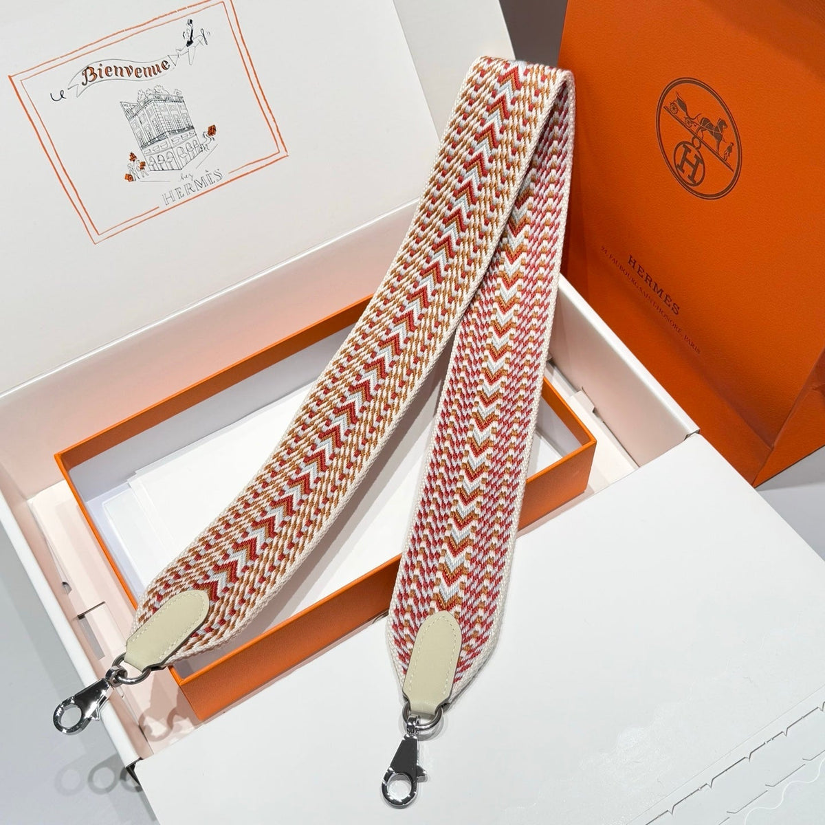 25S HERMES BAG STRAP ORANGE AND RED PATTERN 85 IN CANVAS SILVER HARDWARE