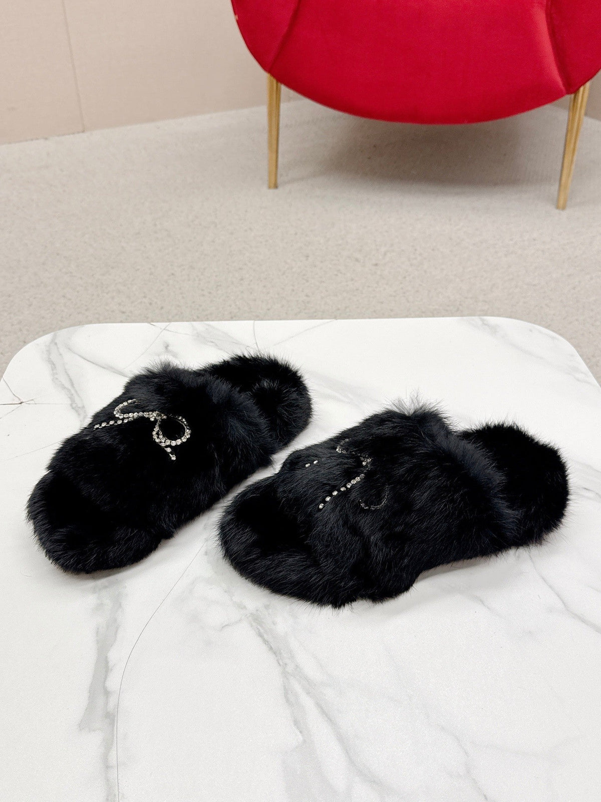 BALENCIAGA 25S SOFT FUR SLIPPERS IN BLACK FUR WITH RHINESTONE BOW