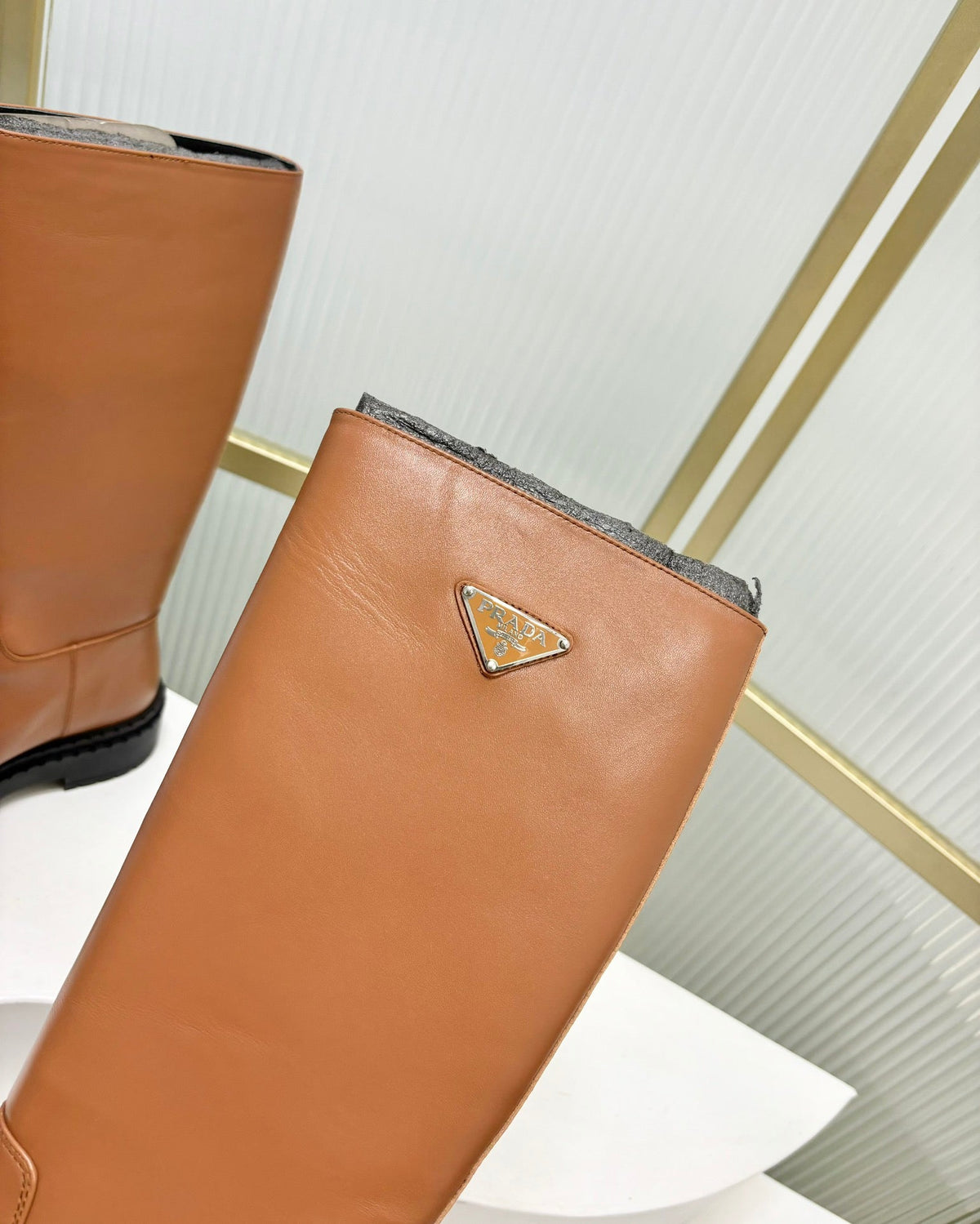 KNEE BOOTS WITH TRIANGLE LOGO IN CAMEL CALFSKIN