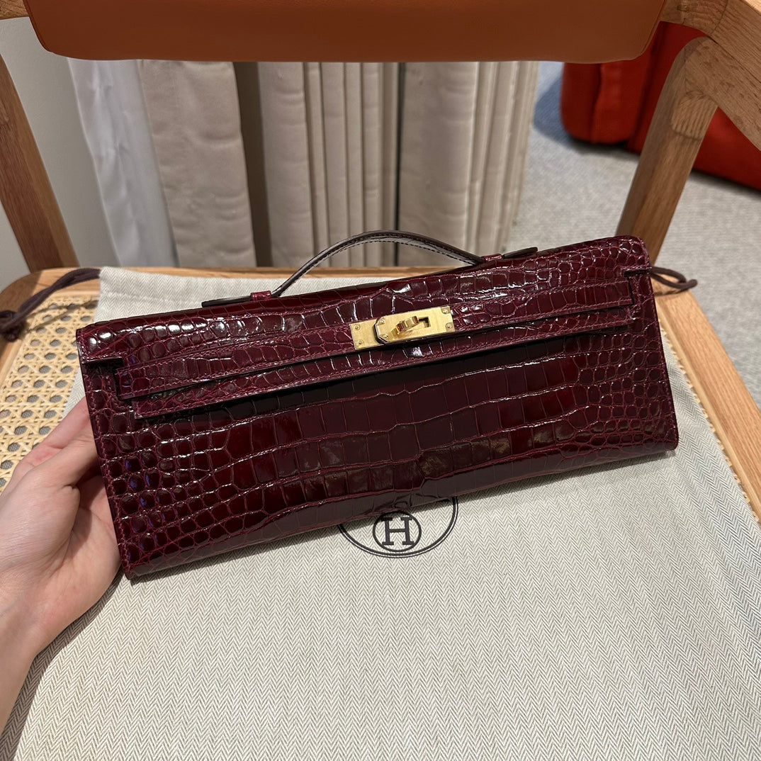 KELLY CUT 31 IN SANGRIA PURPLE ALLIGATOR LEATHER WITH GOLD HARDWARE