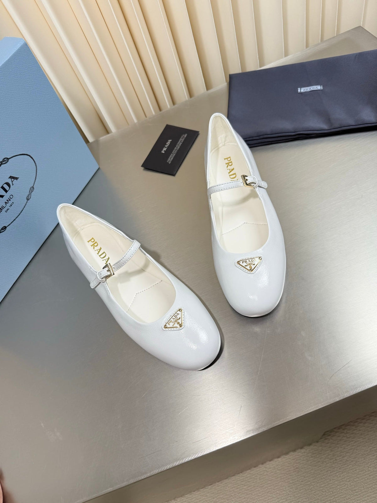 PRADA 26S MARY JANE FLATS IN WHITE CALFSKIN