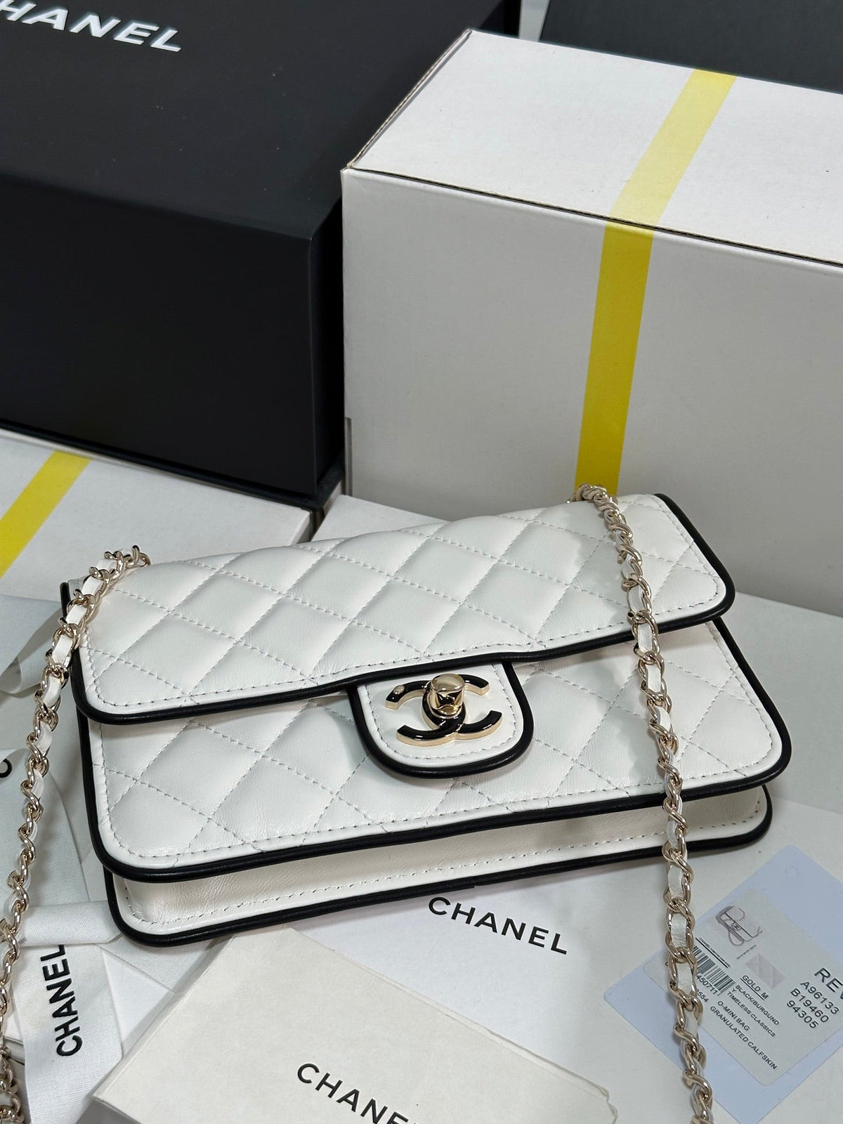 QUILTED FLAP BAG WITH BLACK TRIM 19 IN WHITE LAMBSKIN