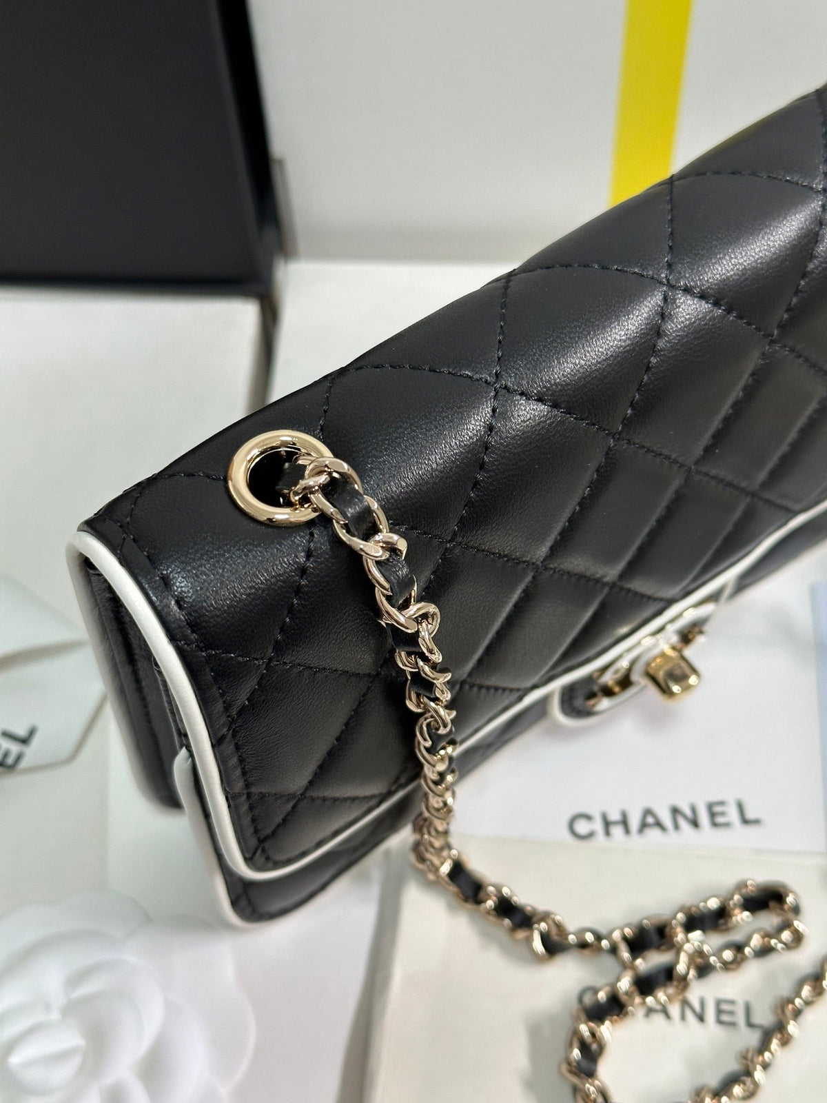 QUILTED FLAP BAG WITH WHITE TRIM 19 IN BLACK LAMBSKIN